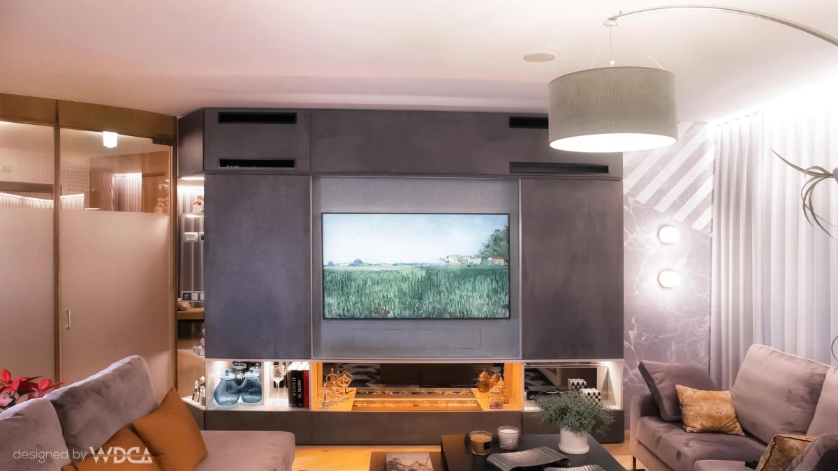 Living room with television, fireplace and decorative lighting