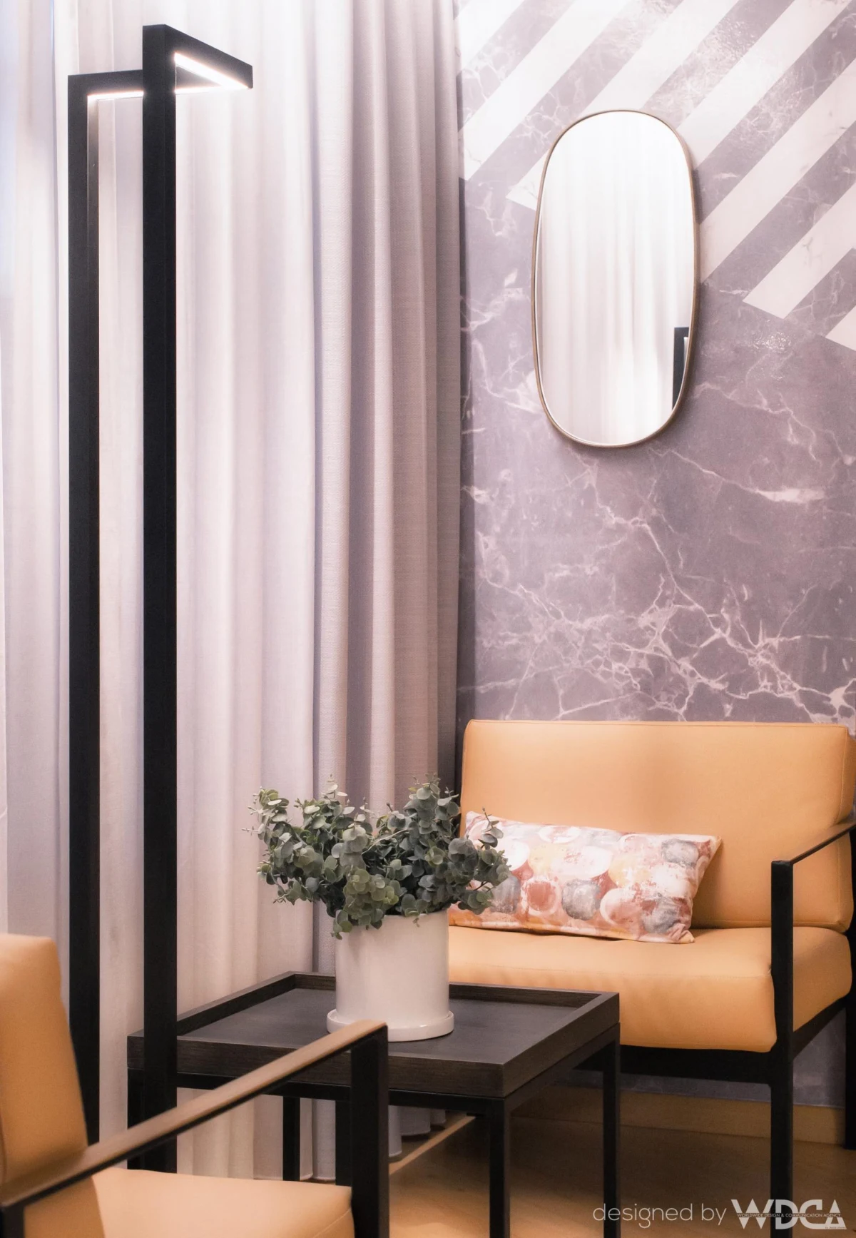 Living room with mirror and black floor lamp