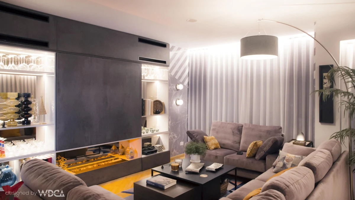 Living room with television, fireplace and decorative lighting