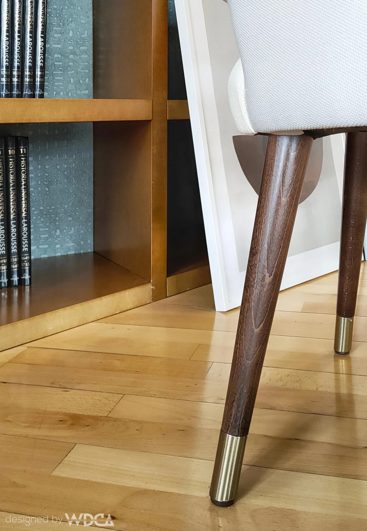 Detail of a timber chair and parquet floor