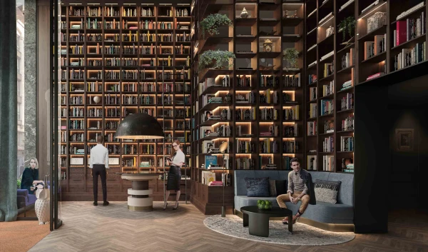 Lille hotel lobby with tall bookshelves and lounge chairs