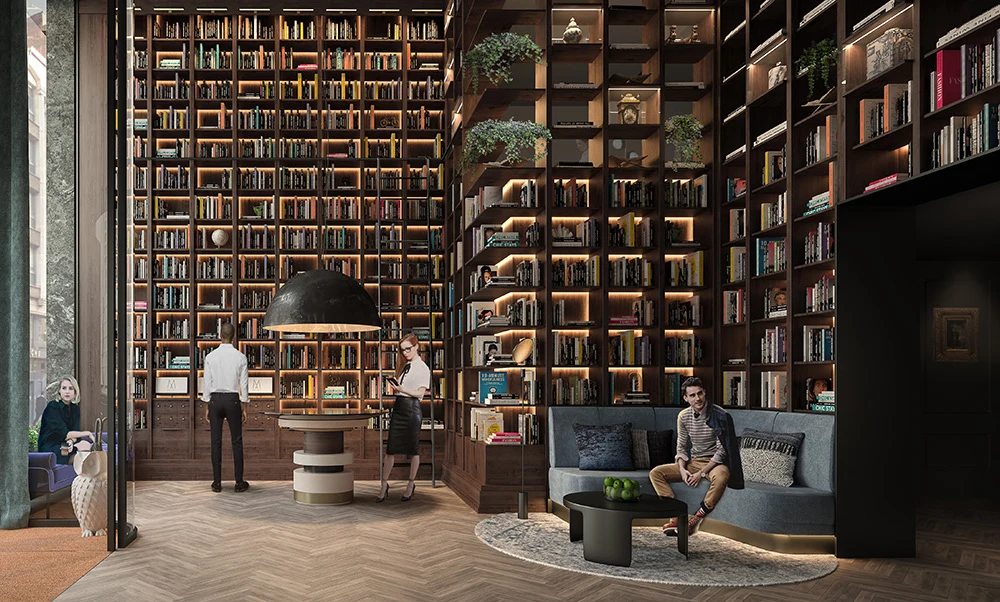 Lille hotel lobby with tall bookshelves and lounge chairs