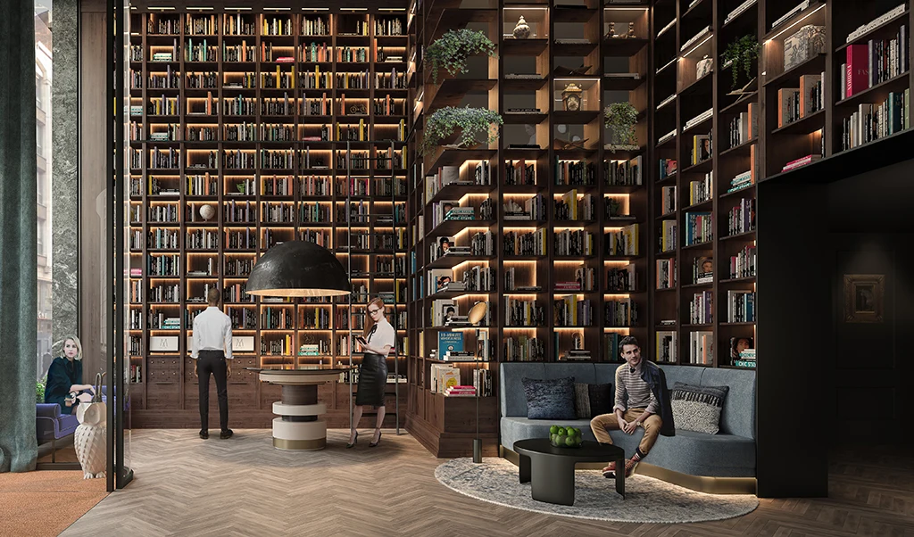 Lille hotel lobby with tall bookshelves and lounge chairs
